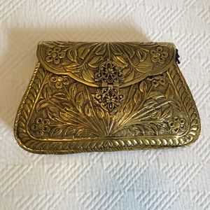 From St Xavier gold metal clutch NWT